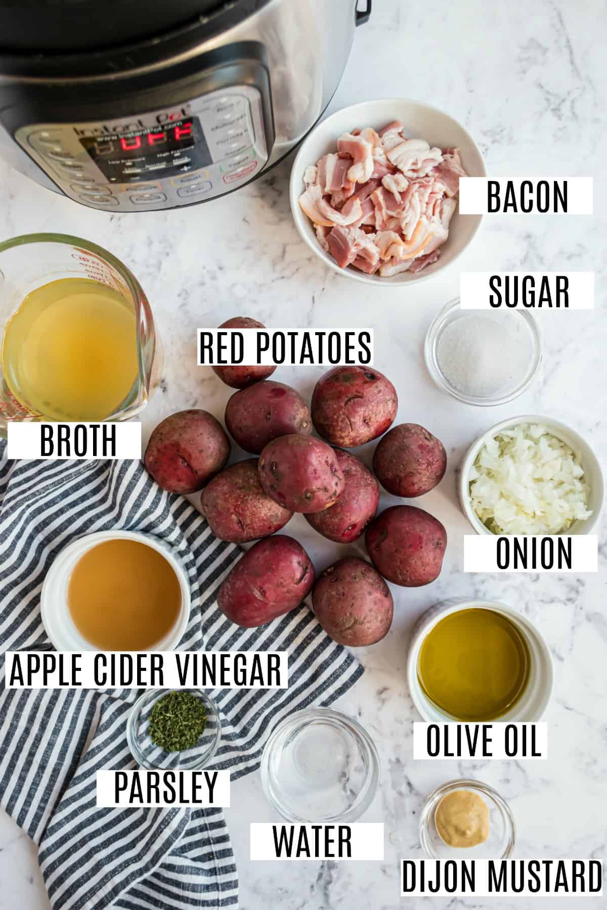 German potato salad ingredients including red potatoes, vinegar, and dijon mustard.