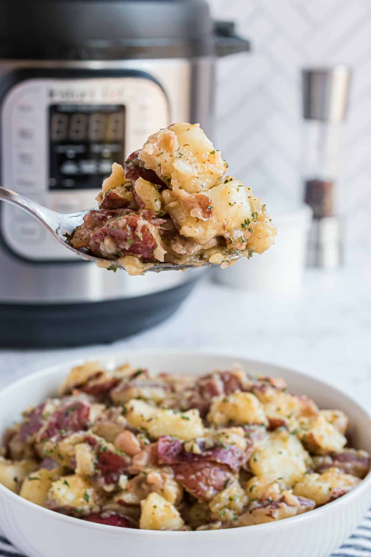 German potato salad with instant pot in background.