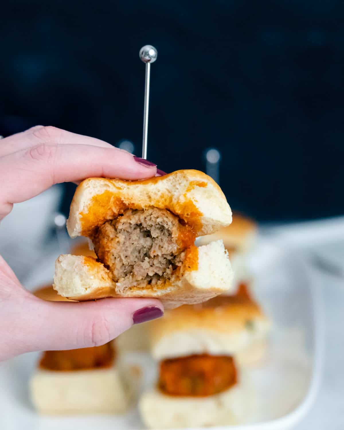 Meatball slider with bite taken out.