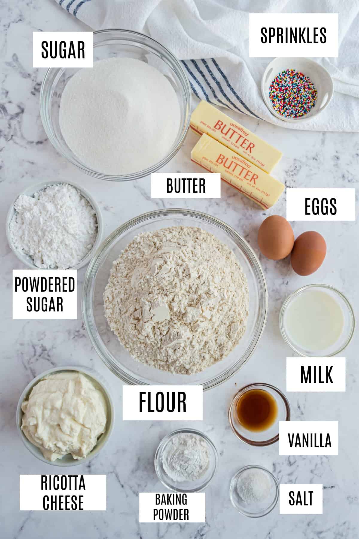 Ingredients needed for ricotta cookies, including butter, eggs, and ricotta cheese.