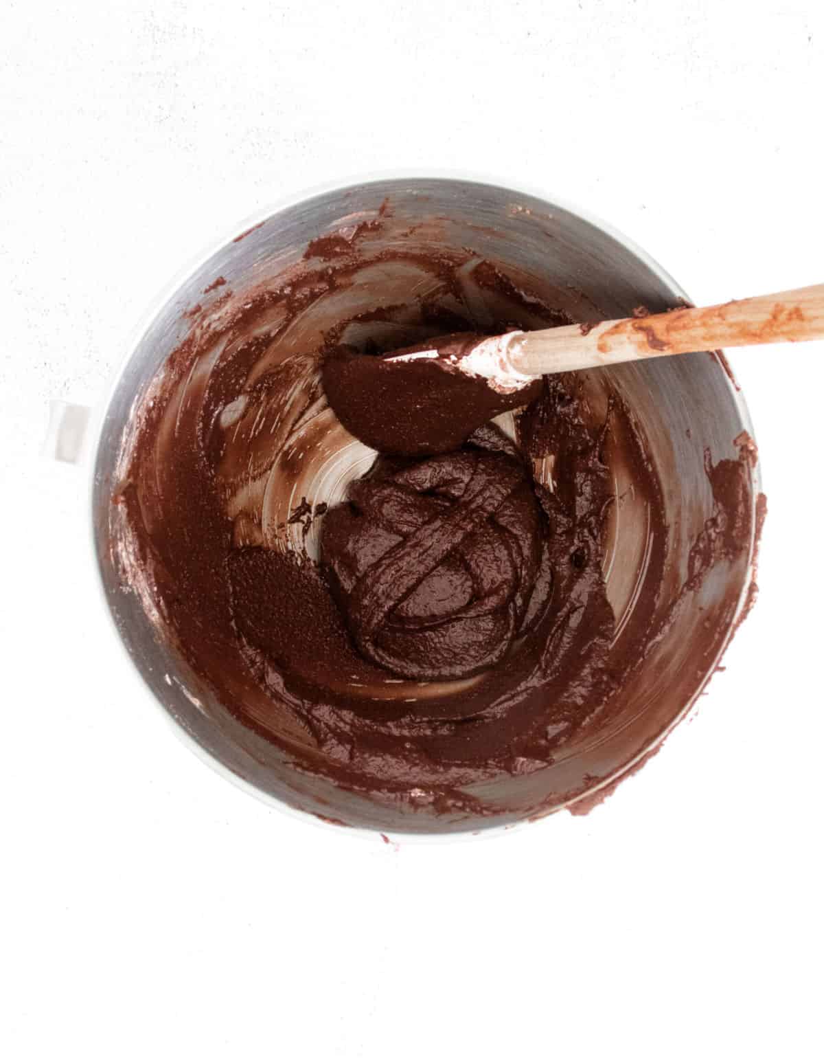 Chocolate macaron batter with figure 8.