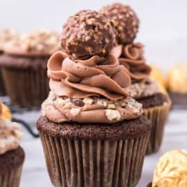 Ferrero rocher topped chocolate cupcake with chocolate frosting.