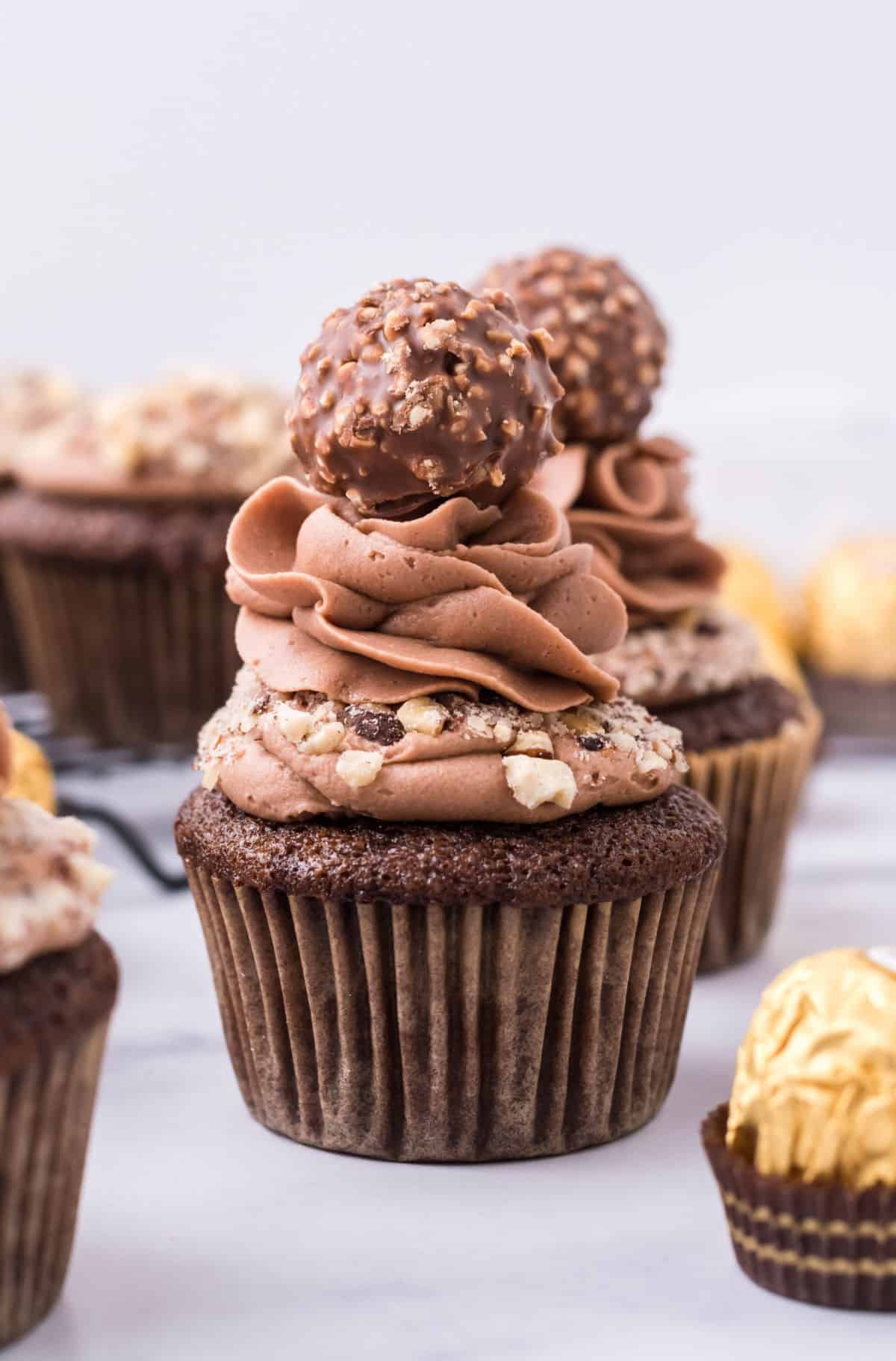 Ferrero rocher topped chocolate cupcake with chocolate frosting.