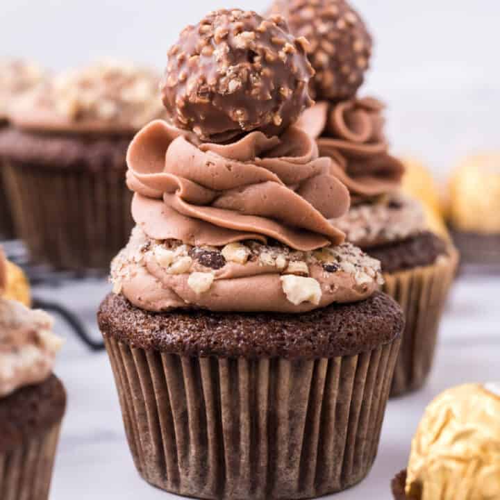 Chocolate and Hazelnut combine to make Ferrero Rocher Cupcakes! Sweet and nutty with an irresistible Nutella frosting, these are a must try dessert for any occasion.
