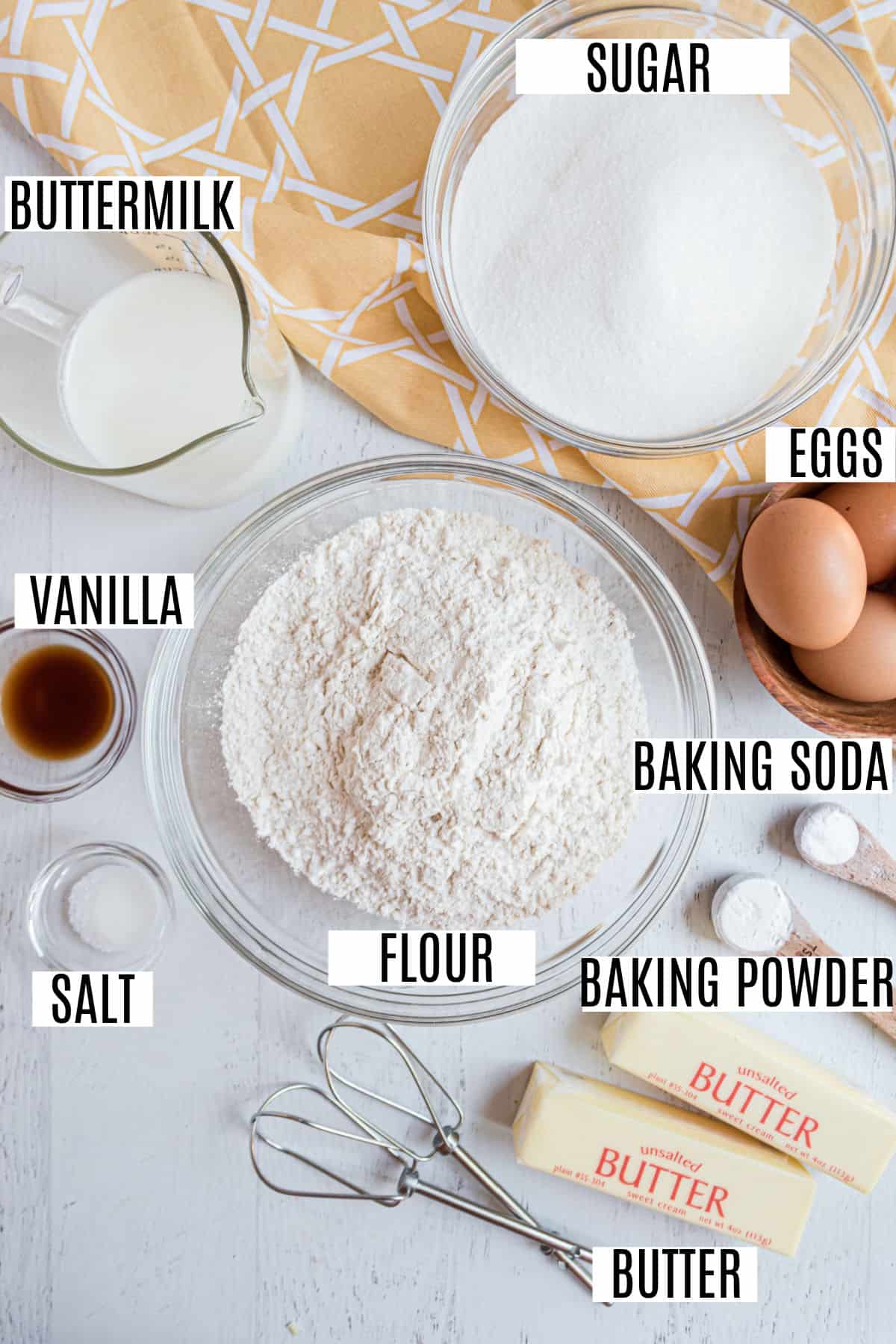 Ingredients needed to make kentucky butter cake, including buttermilk.