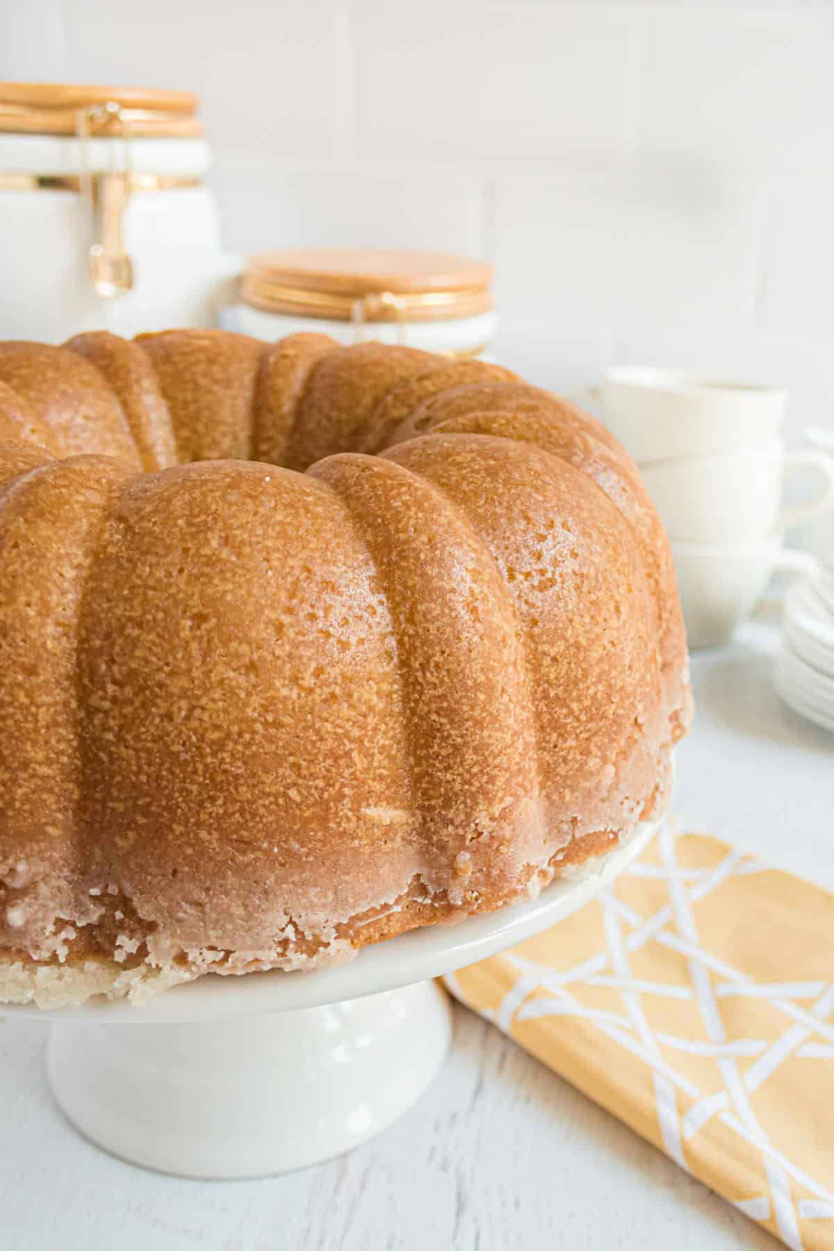 Kentucky butter cake on a white cake plate.