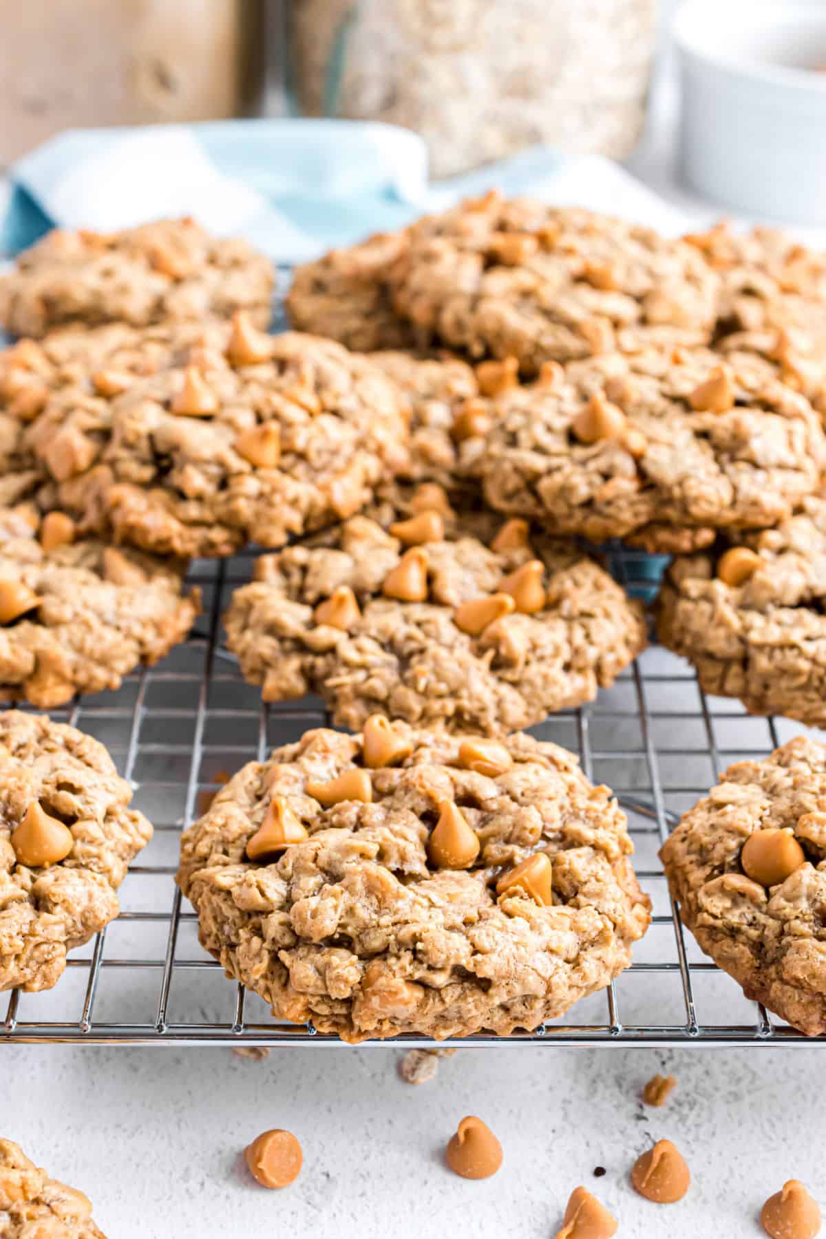 Oatmeal scotchies stacked on cooling rack.
