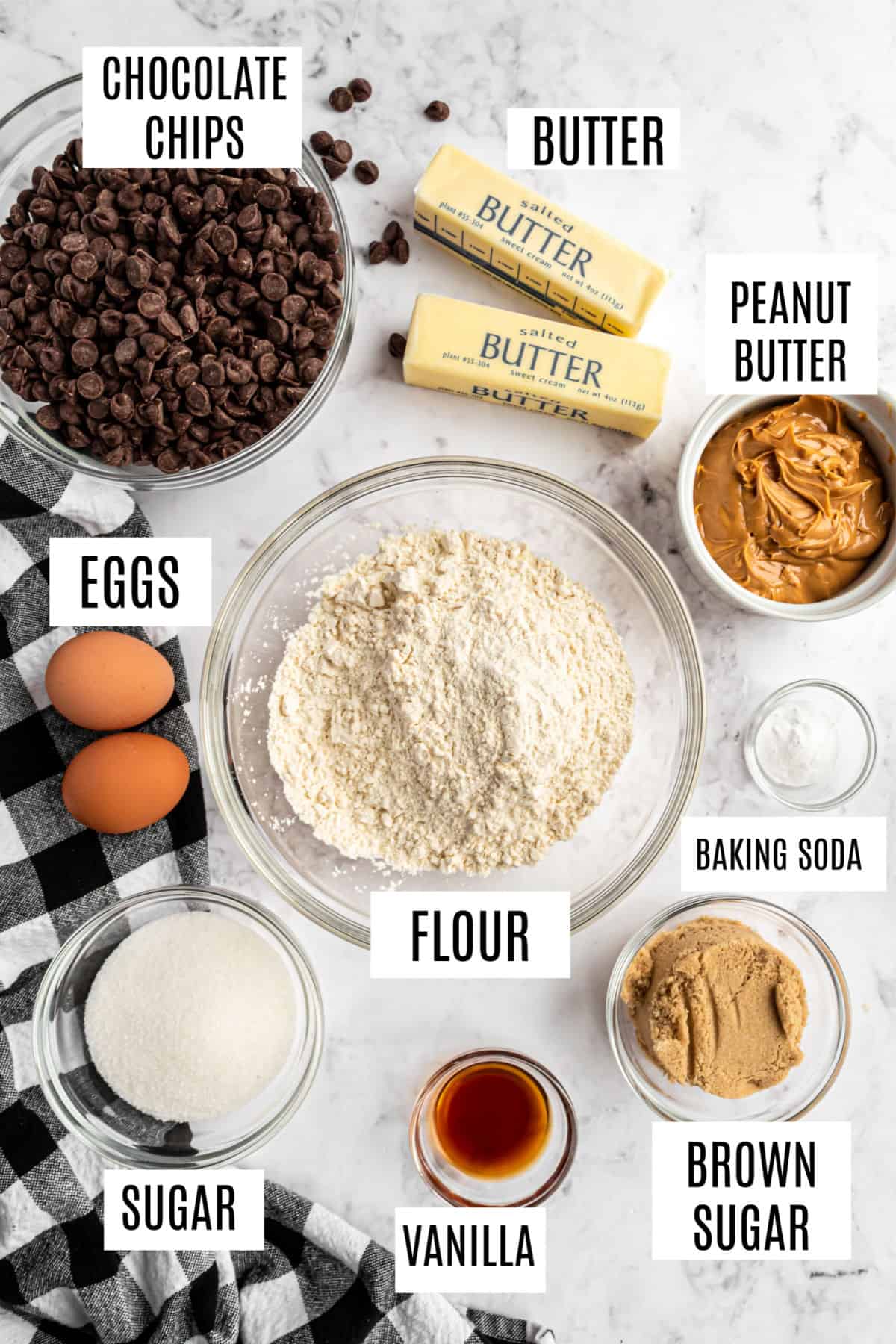 Ingredients needed to make peanut butter swirled chocolate chip cookie bars.