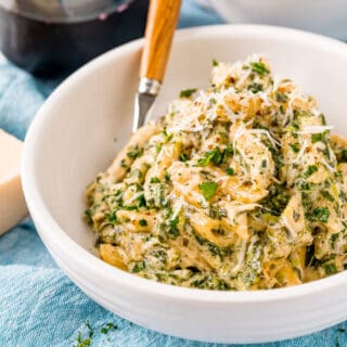 Spinach Alfredo Pasta Bake is the ultimate in easy cooking! Skip the pizza delivery and make a delicious and nourishing homemade dinner--all in one pan.