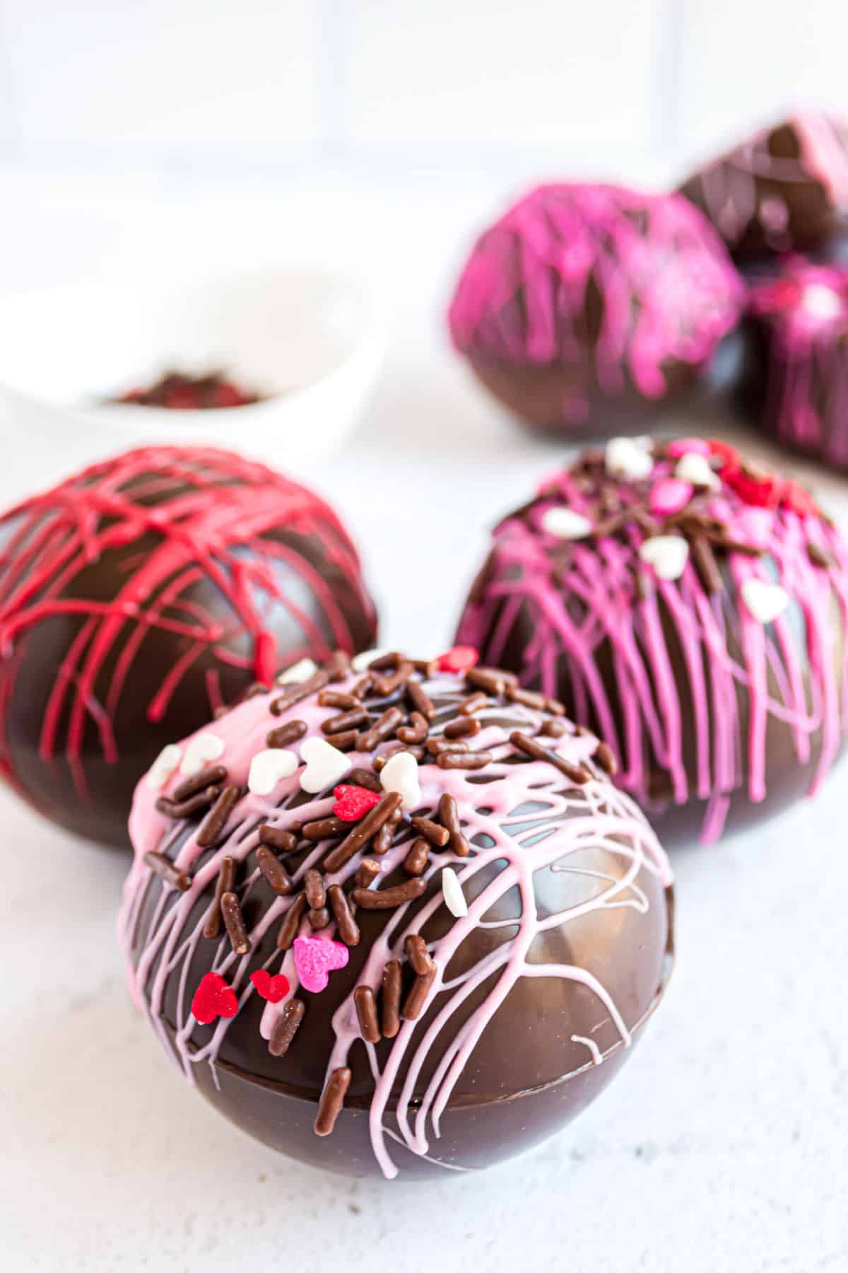 Valentine's day hot cocoa bombs made in sphere mold.