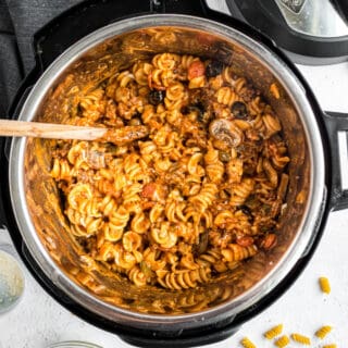 When you can't decide between pizza and pasta, make both!This Instant Pot Pizza Pasta brings all your favorite pizza toppings together in an easy one-pot pasta dinner.