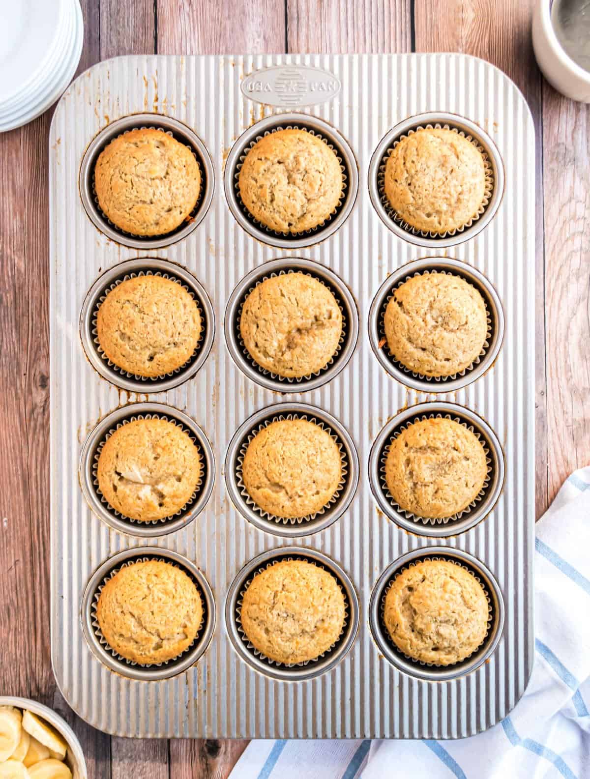 Banana muffins in metal muffin tin.