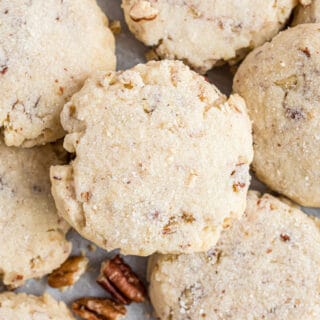 Light and crumbly Pecan Sandies may look simple but don't let that fool you; these easy-to-make cookies are filled with irresistible buttery pecan flavor. You won't be able to eat just one!