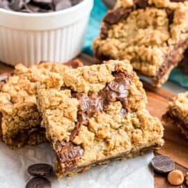 Filled with oatmeal and butterscotch, these classic Revel Bars get an extra dose of deliciousness from triple the chips. Fudgy, chewy, chocolate-y oatmeal cookie bar perfection!