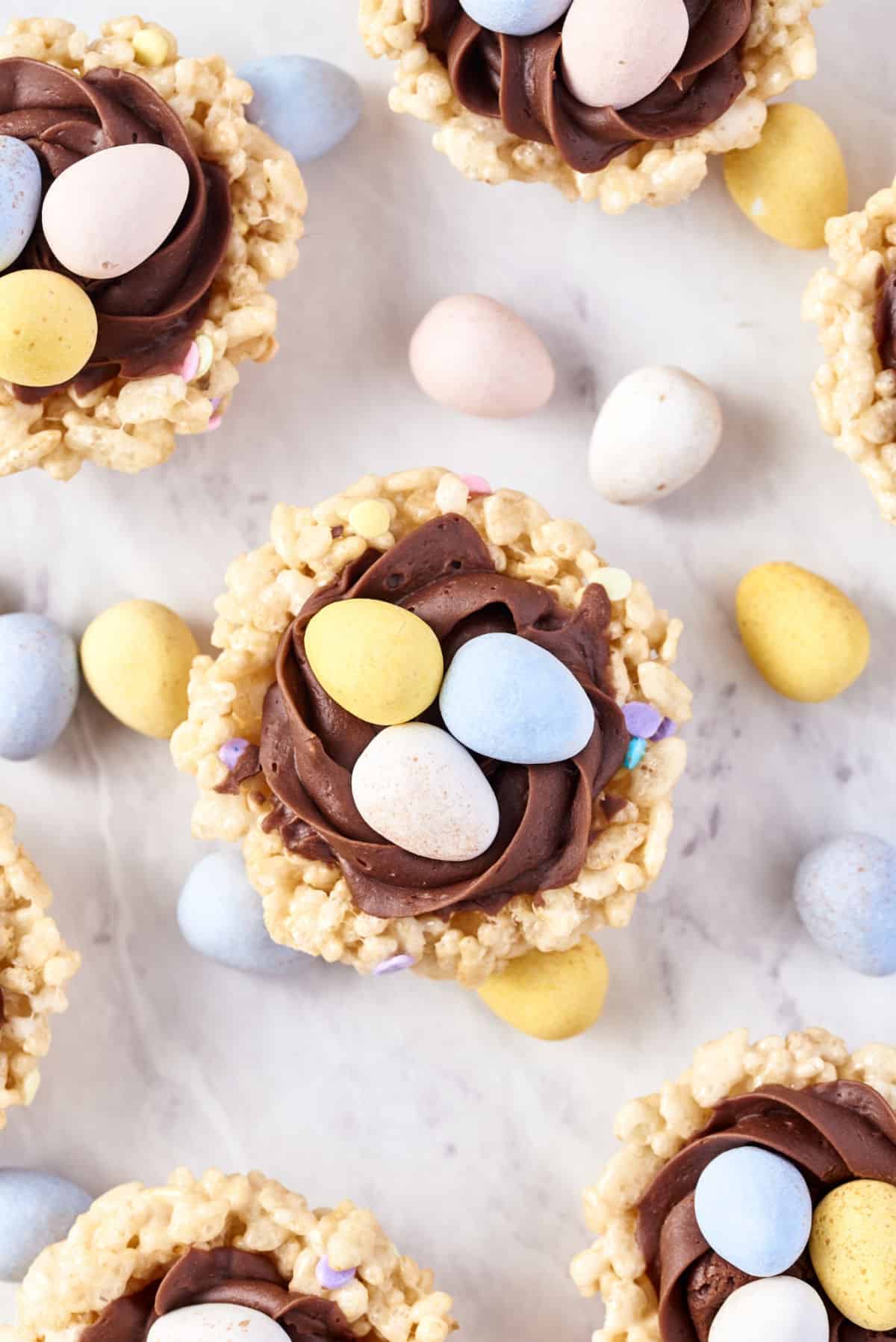 Overhead photos of easter egg nests made from rice krispie treats.