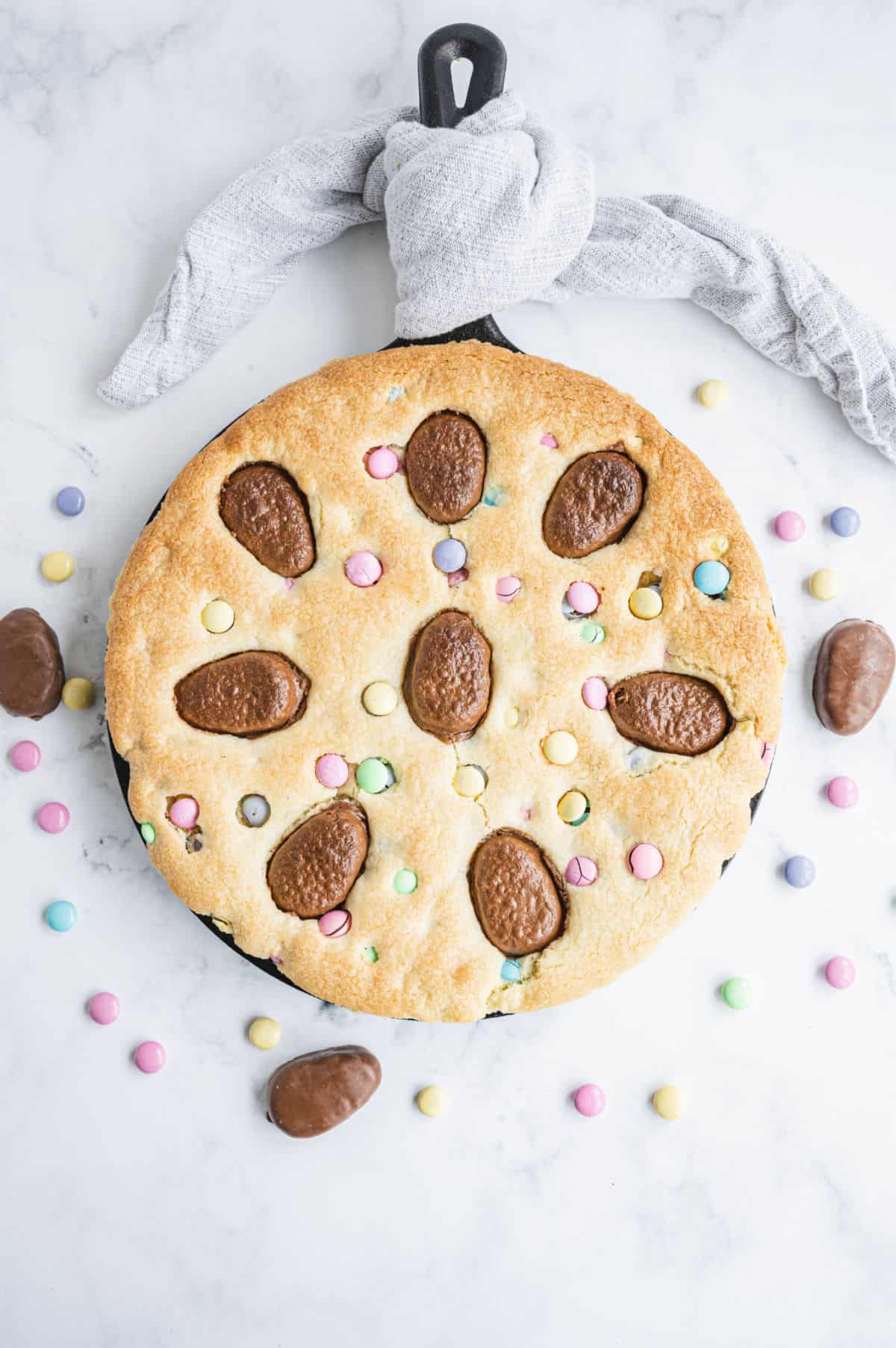 Sugar cookie cake baked in a skillet for Easter.