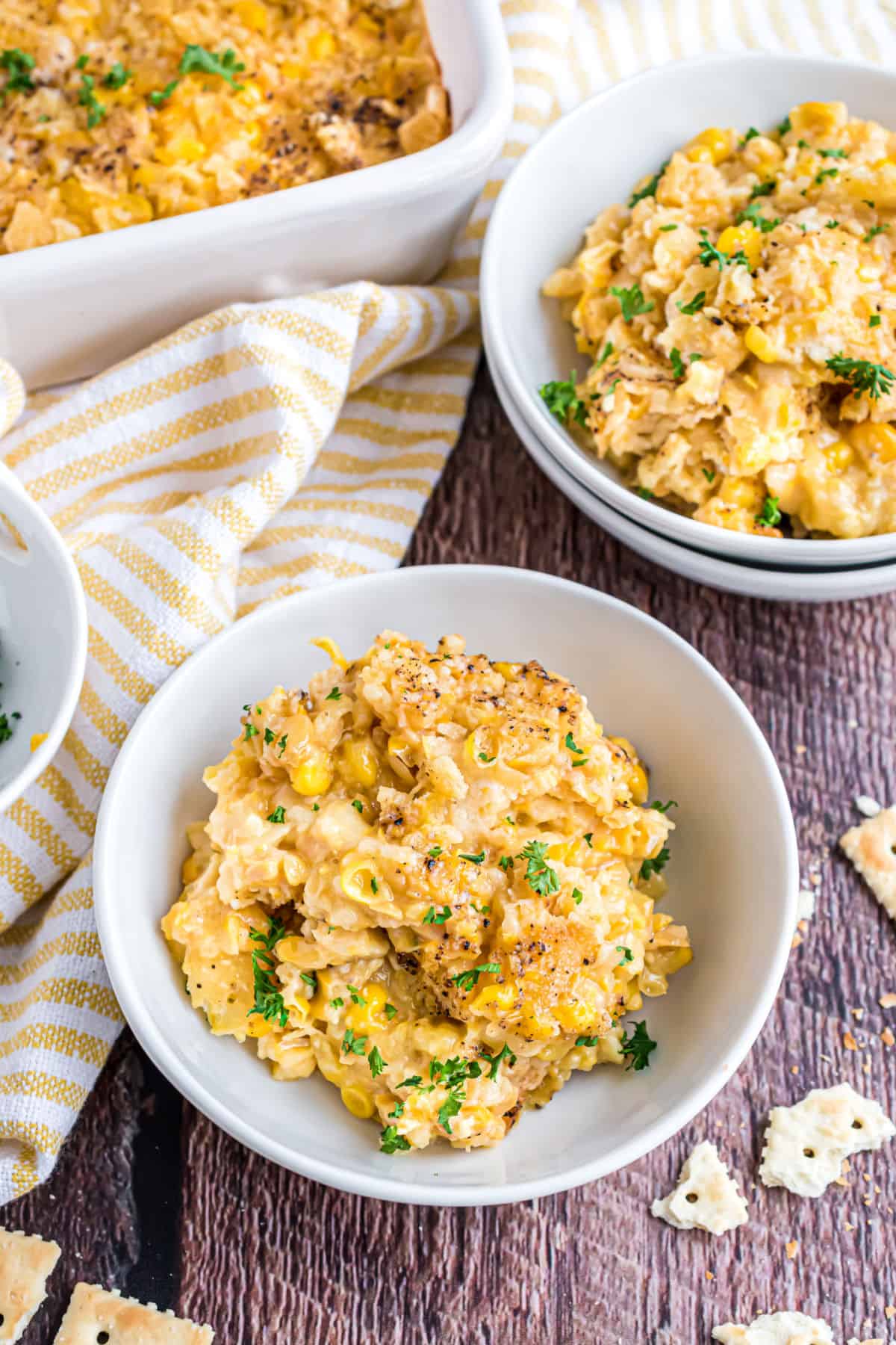 Corn casserole in small white bowls for serving.