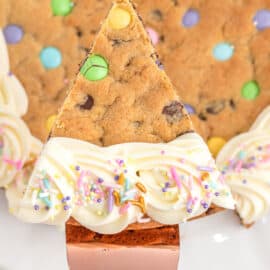 Easter cookie cake with frosting and pastel candies.