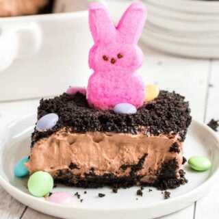A chocolate pudding cake covered in Oreos makes Easter even sweeter! Easter Dirt Cake garnished with pastel M&Ms is an easy, no bake dessert that has everyone hopping back for seconds.