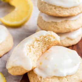 Lemon ricotta cookies with lemon icing, one bite taken.