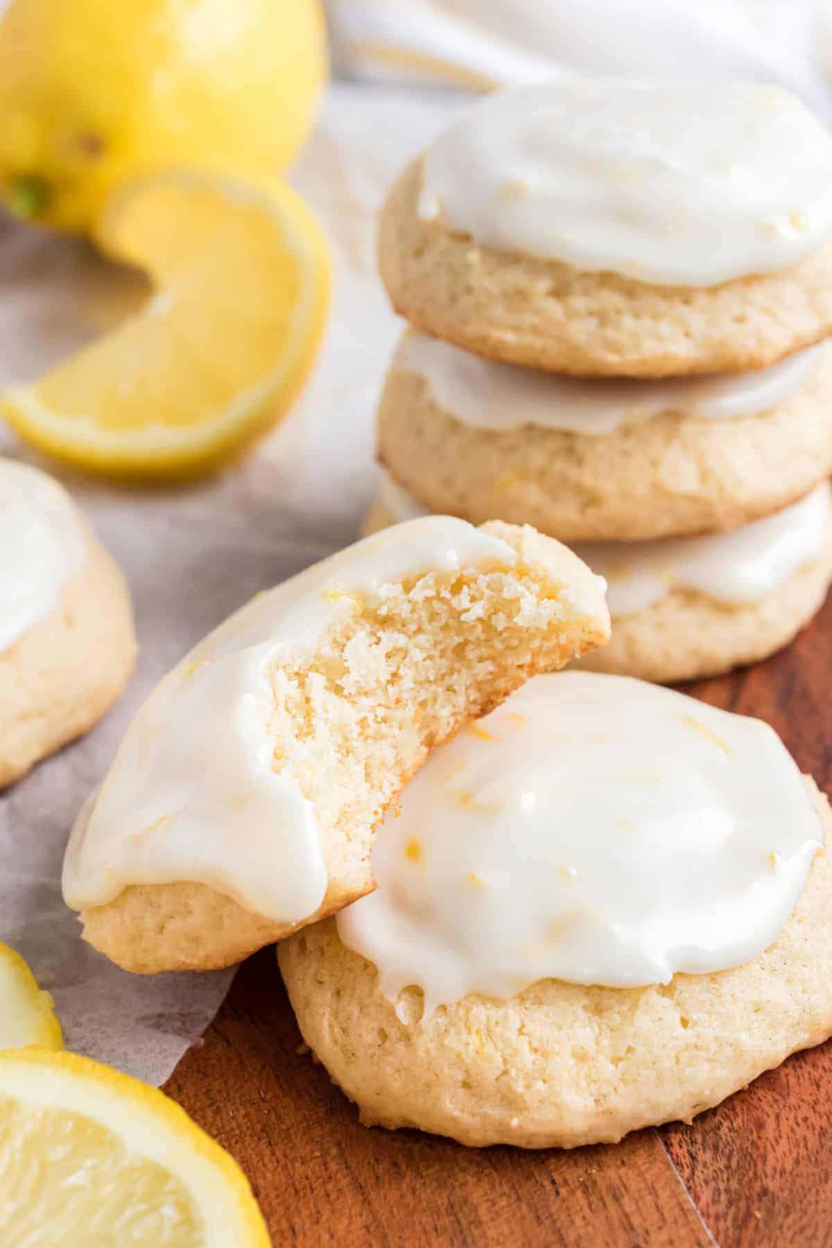 Lemon ricotta cookies with lemon icing, one bite taken.