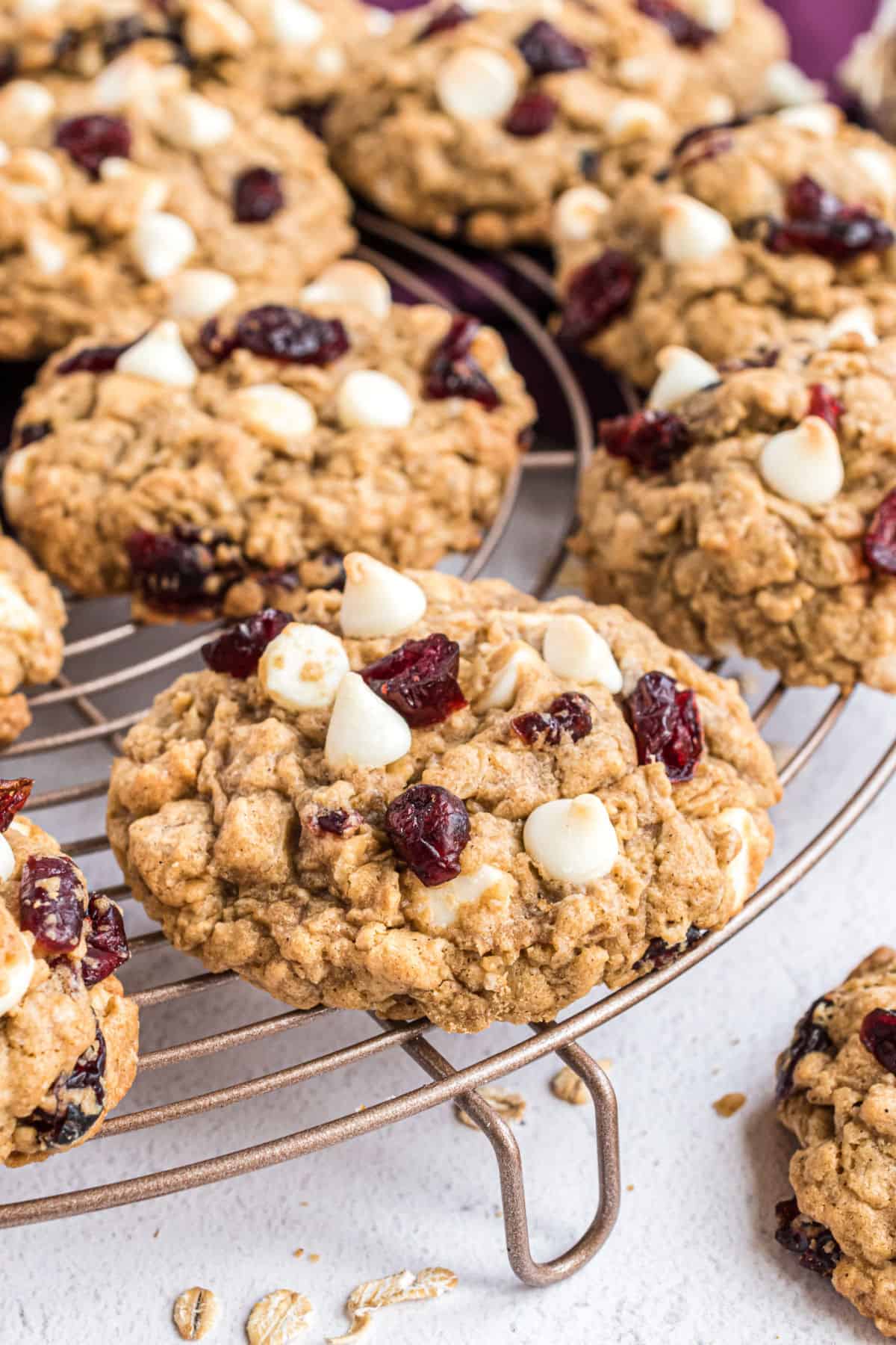 White chocolate cranberry oatmeal cookies on a cooling rack.
