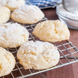 Cheesecake cookies cooling on wire rack.