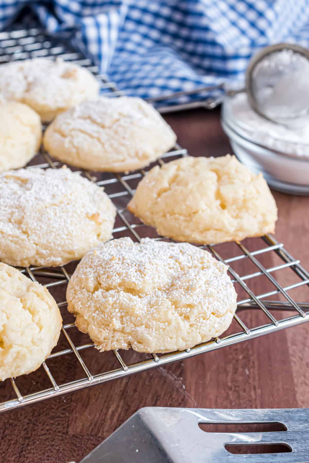 Cheesecake cookies cooling on wire rack.