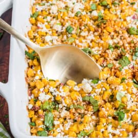 Mexican street corn salad baked in square dish.