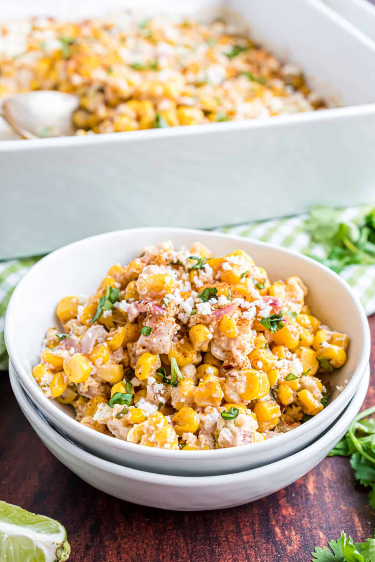 Mexican street corn salad served in a white bowl.