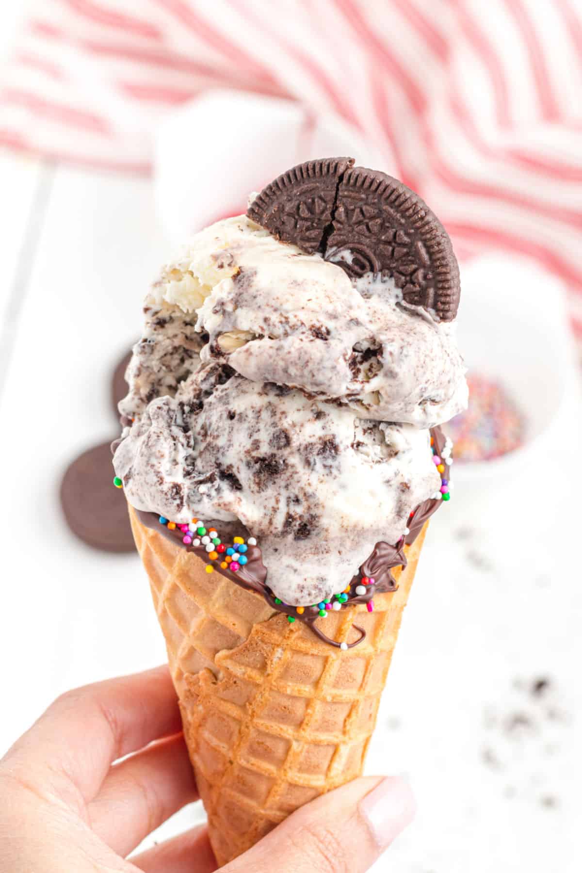 Cookies and cream ice cream in a waffle cone.