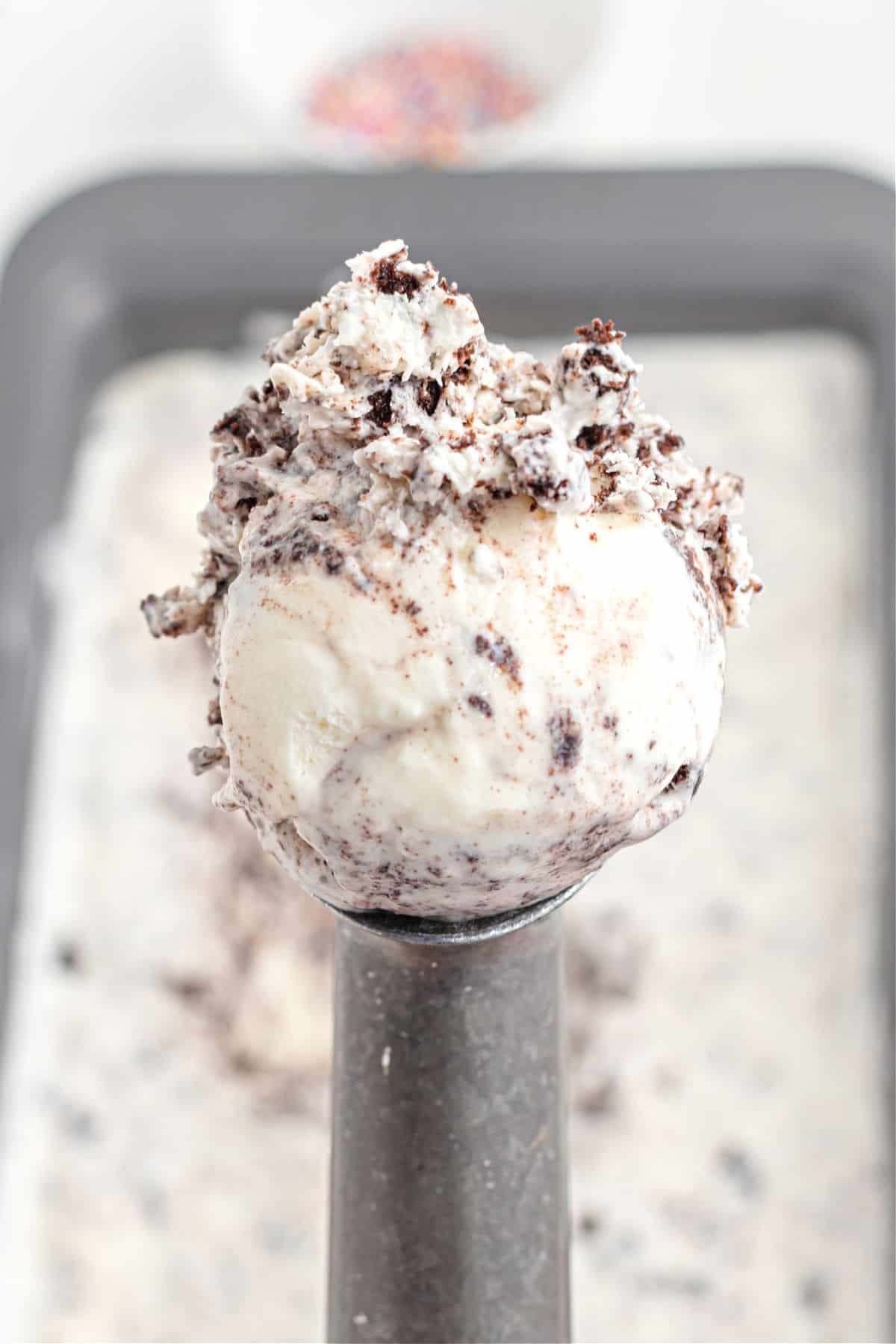 Oreo ice cream scoop on a metal scooper.