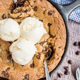 Chocolate chip cookie baked in a skillet and topped with vanilla ice cream.