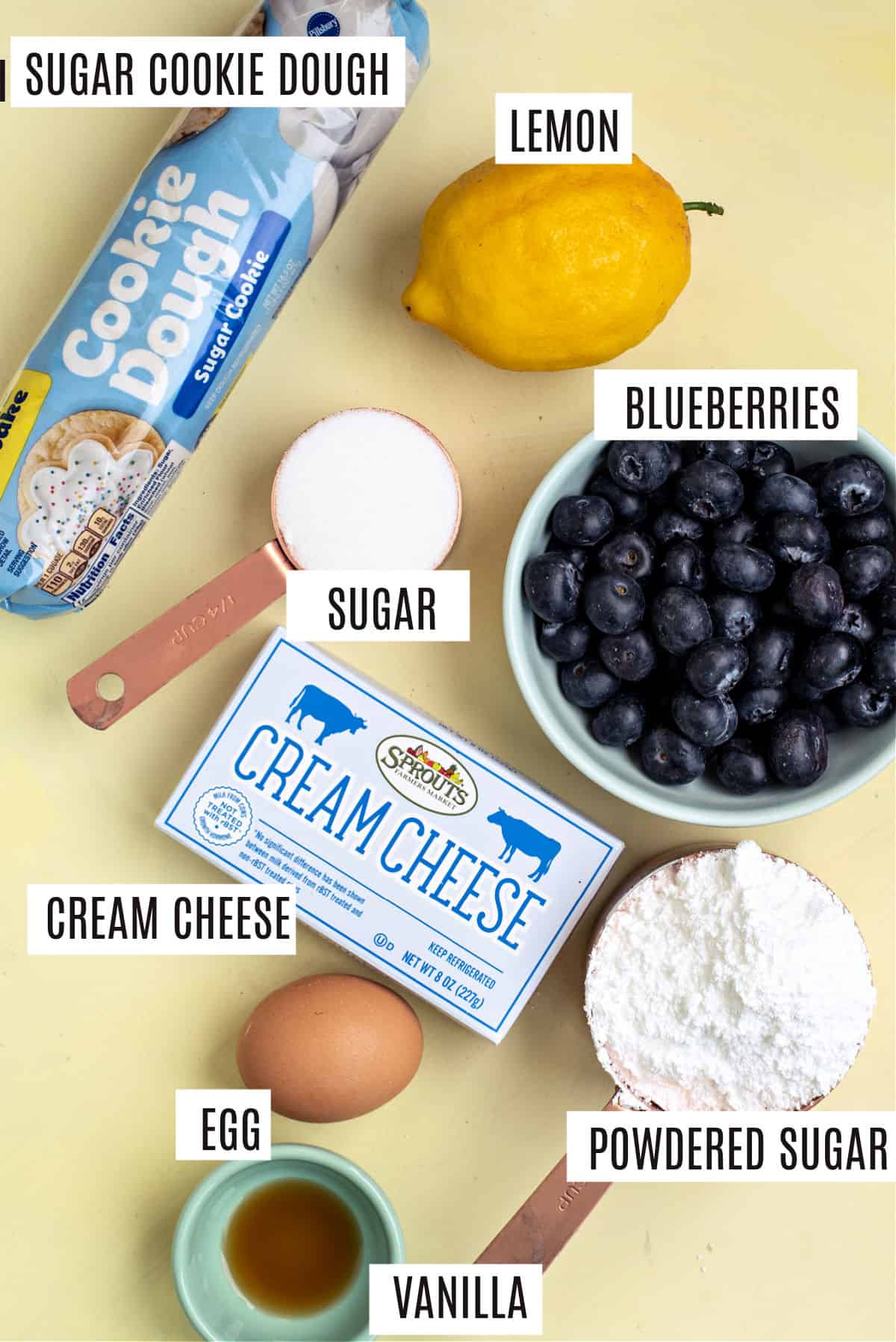 Ingredients needed for blueberry cheesecake sugar cookie bars.