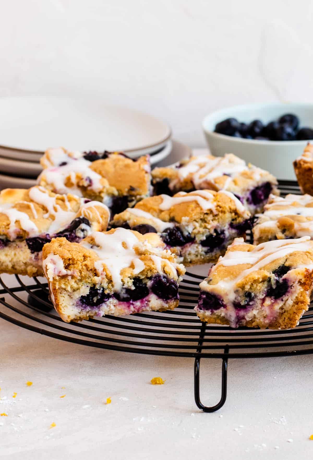 Blueberry cheesecake sugar cookie bars are round wire rack.