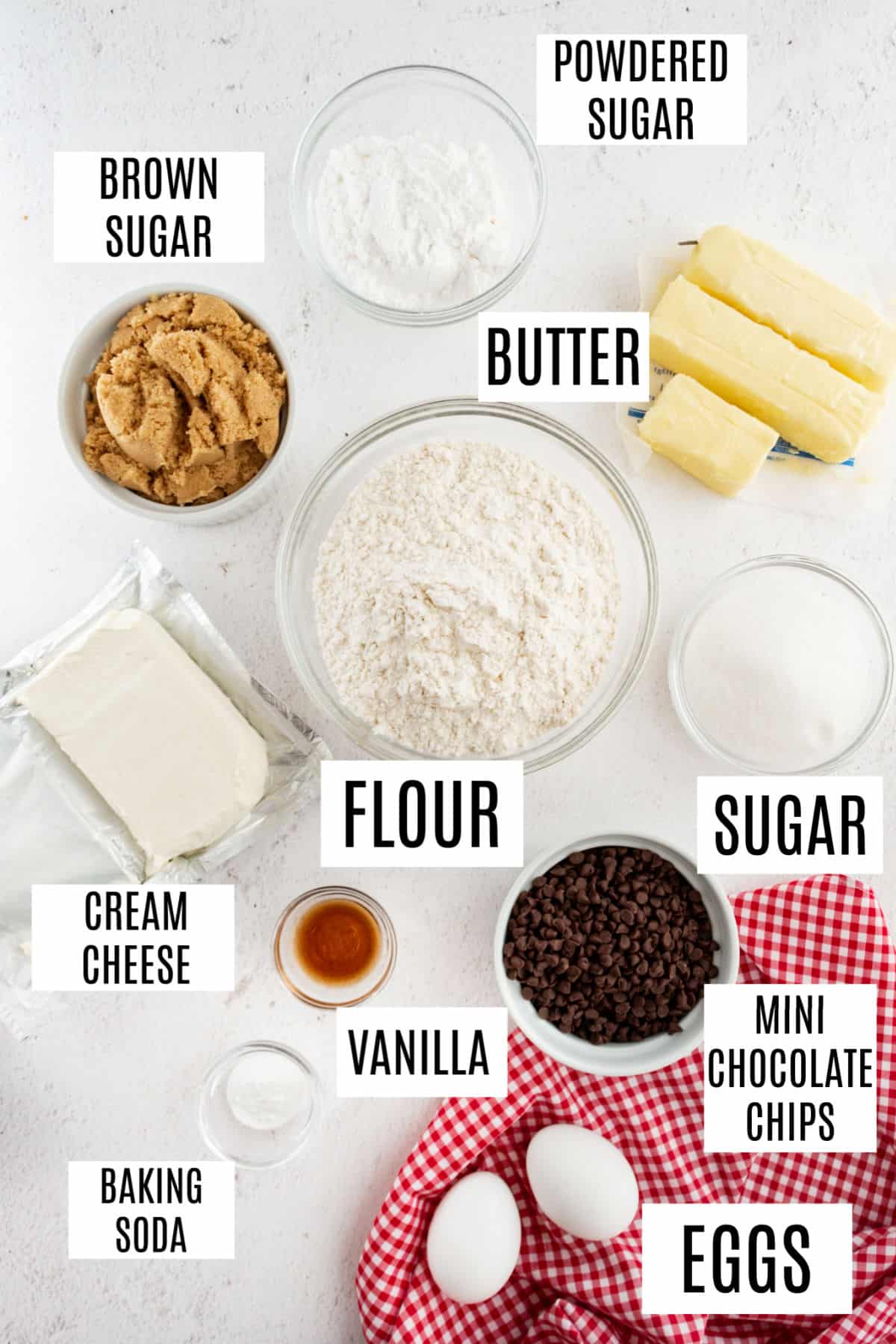 Ingredients needed to make chocolate chip cheesecake cookies.