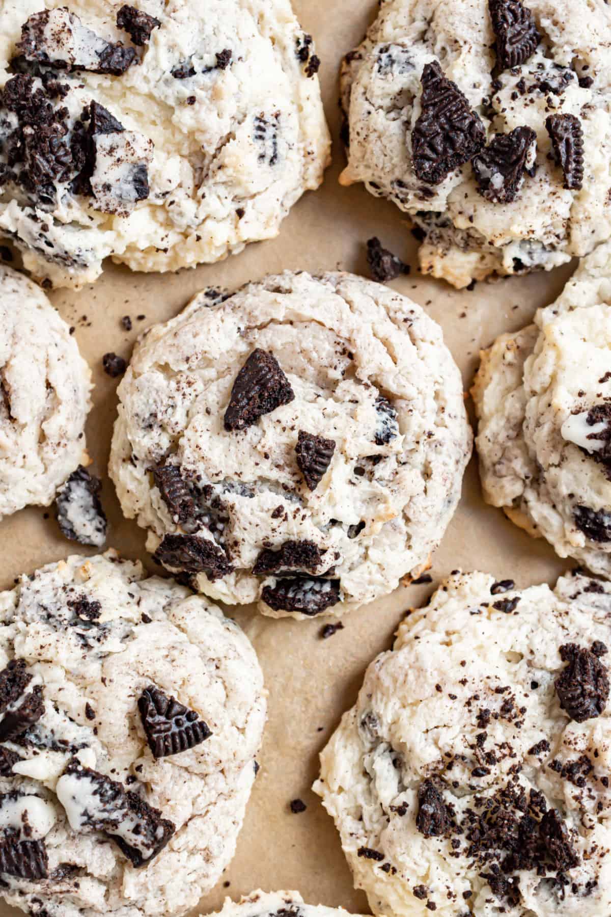 Oreo cheesecake cookies on parchment paper.