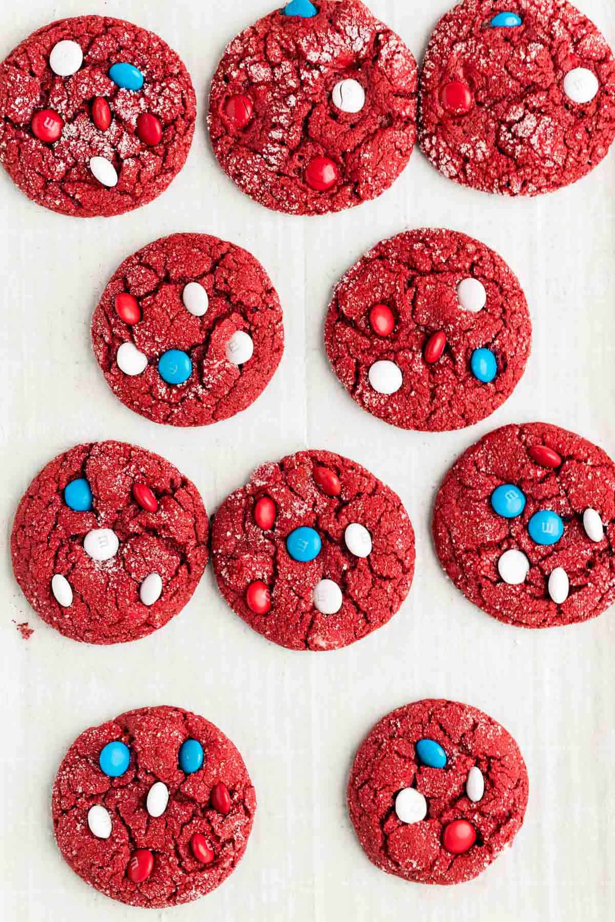 Red velvet cake mix cookies on parchment paper.