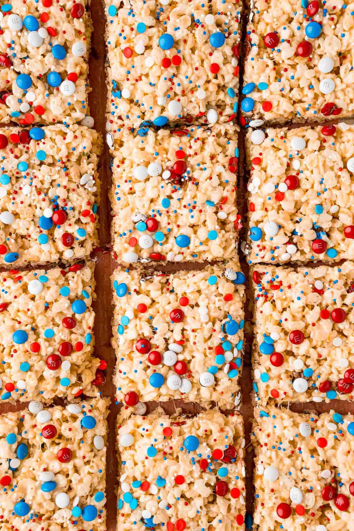 Red white and blue rice krispie treats cut into squares.