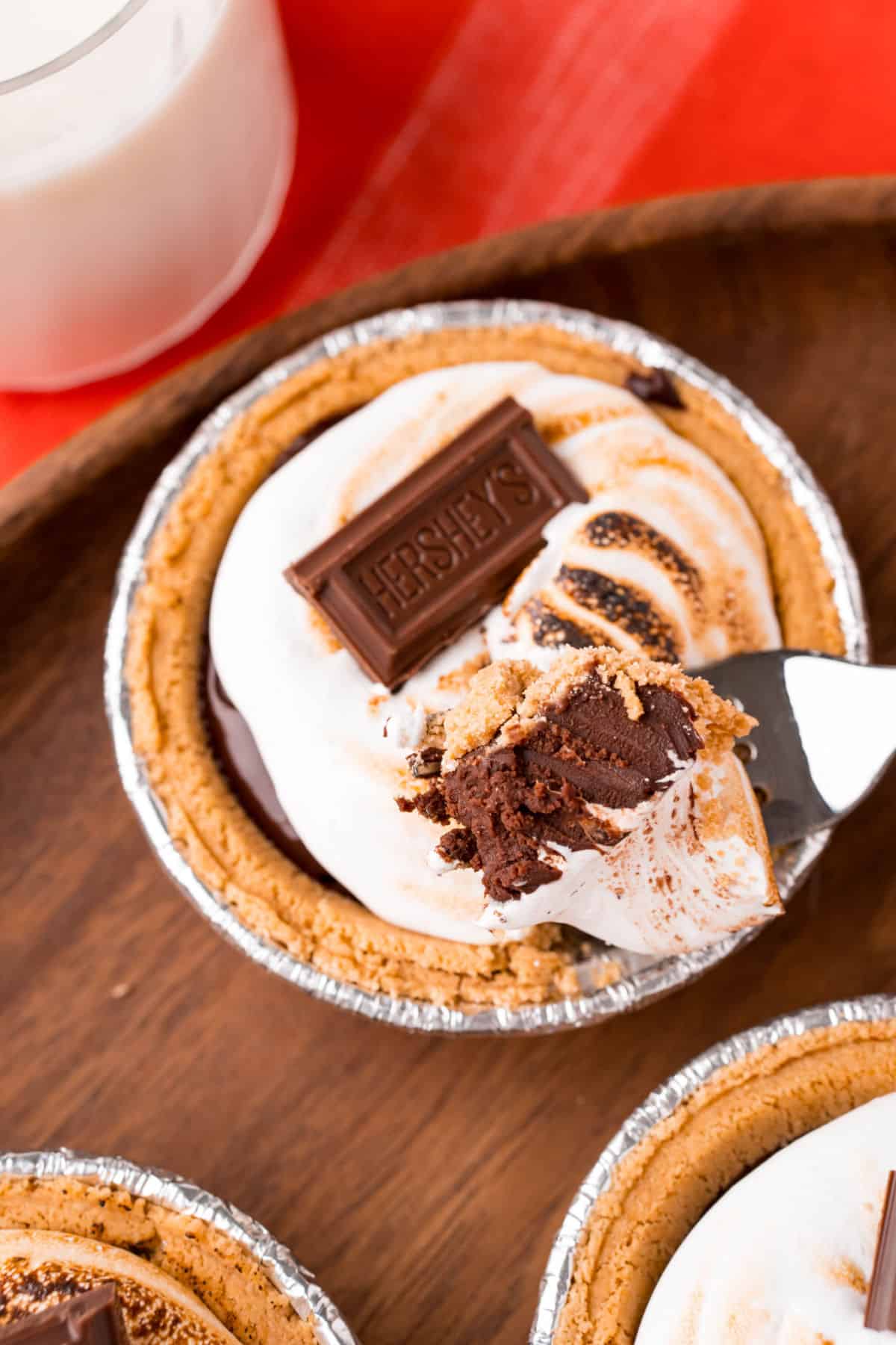 S'mores pie with a bite removed.