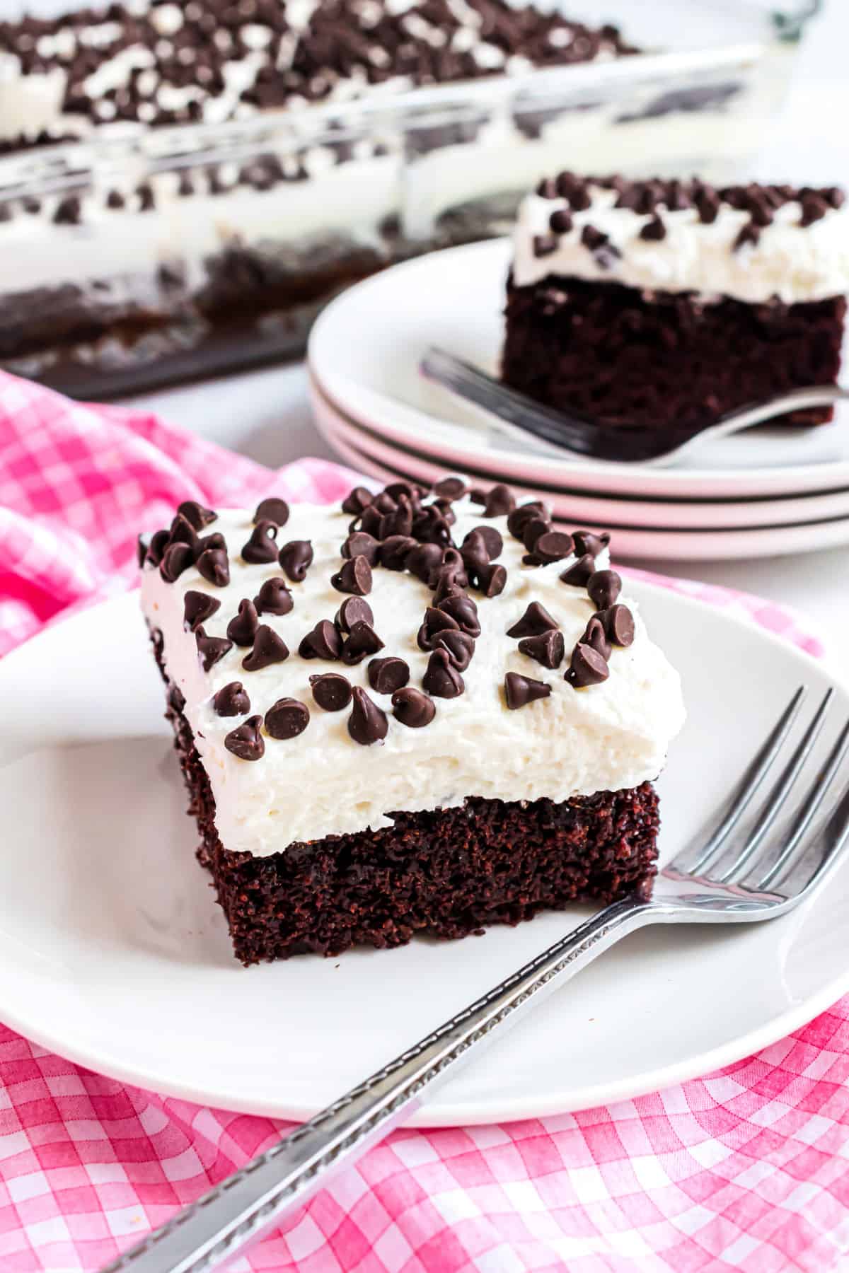 Slice of dark chocolate cake made in a 13x9.