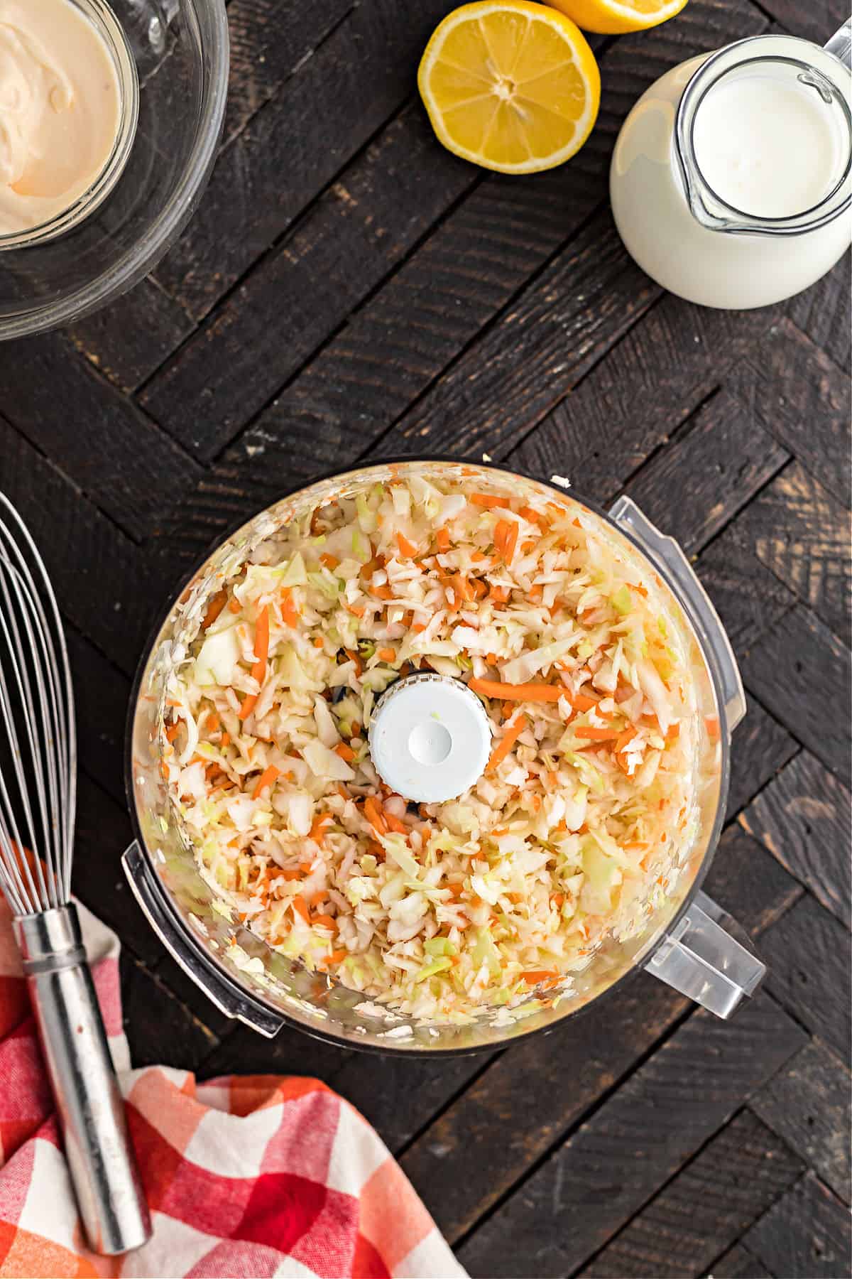 Carrots and cabbage in food processor shredded.