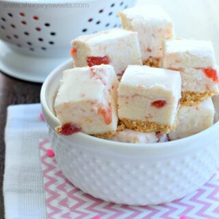 Strawberry shortcake fudge in a white bowl.