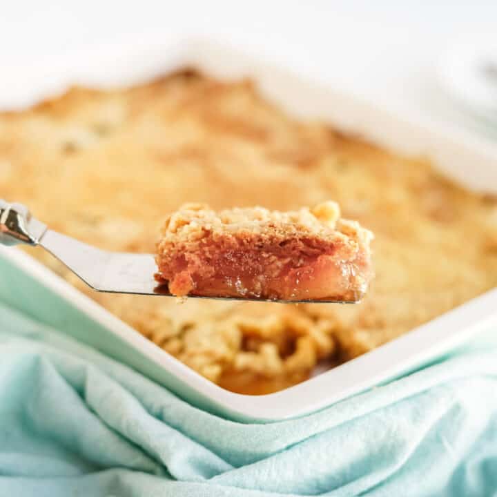 Slice of apple dump cake on spatula.