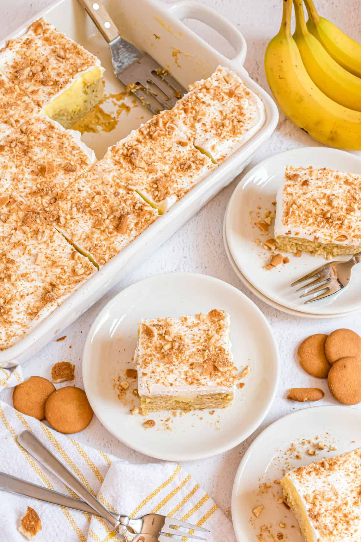 Slices of banana cake served on white plates.