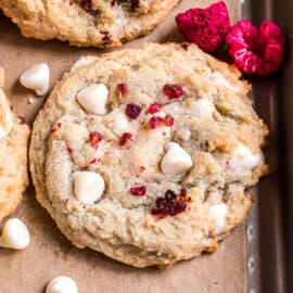 White chocolate chip cookie with raspberries.