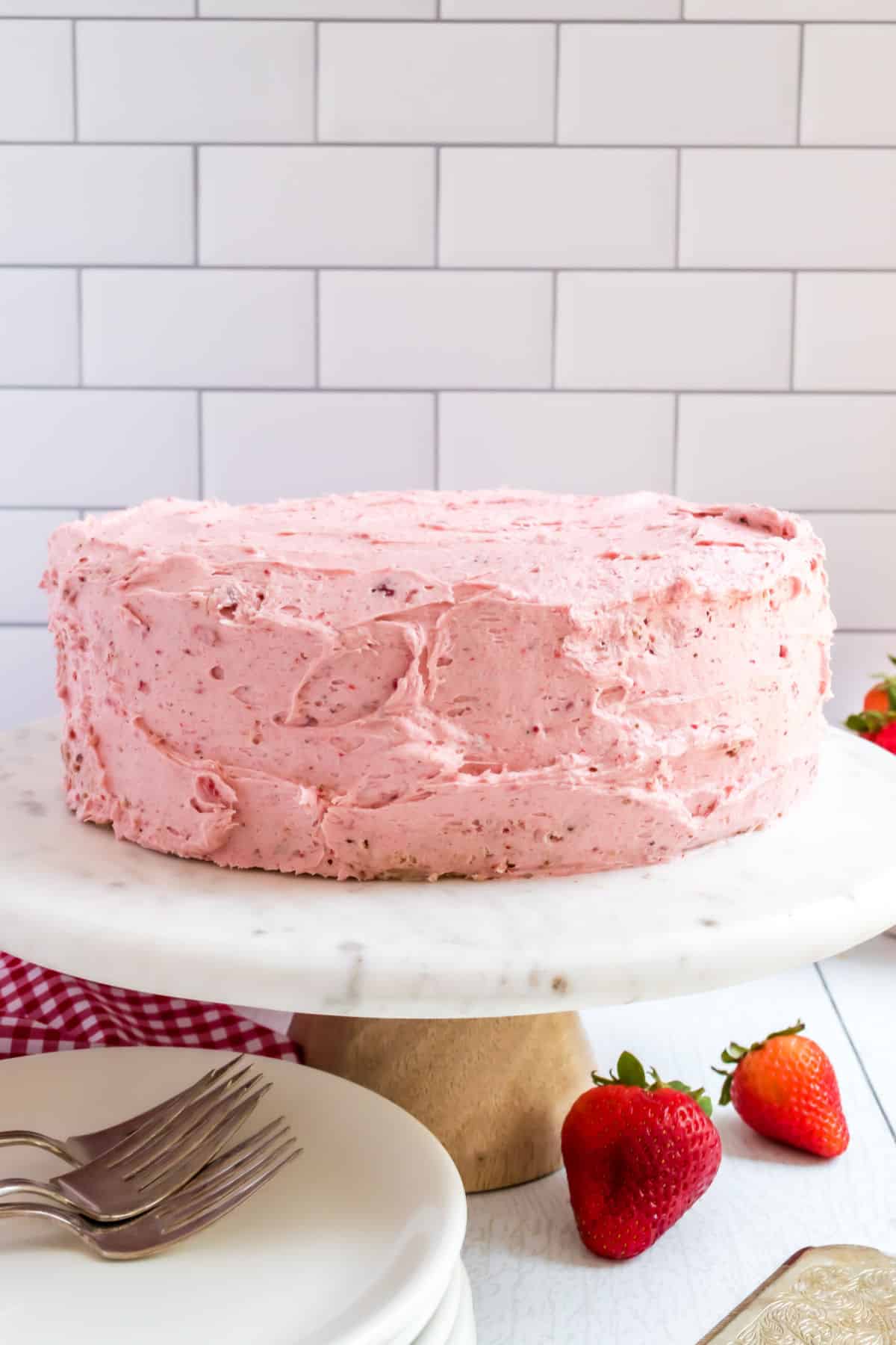 Strawberry frosting on a strawberry layer cake.