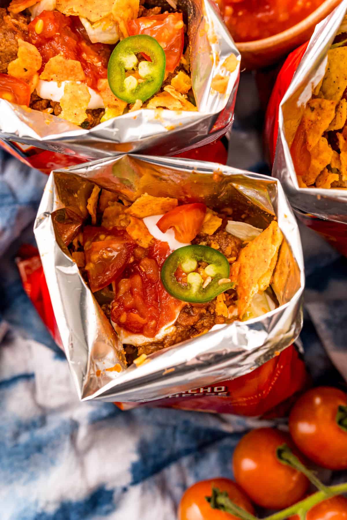 Bags of doritos with taco filling inside.