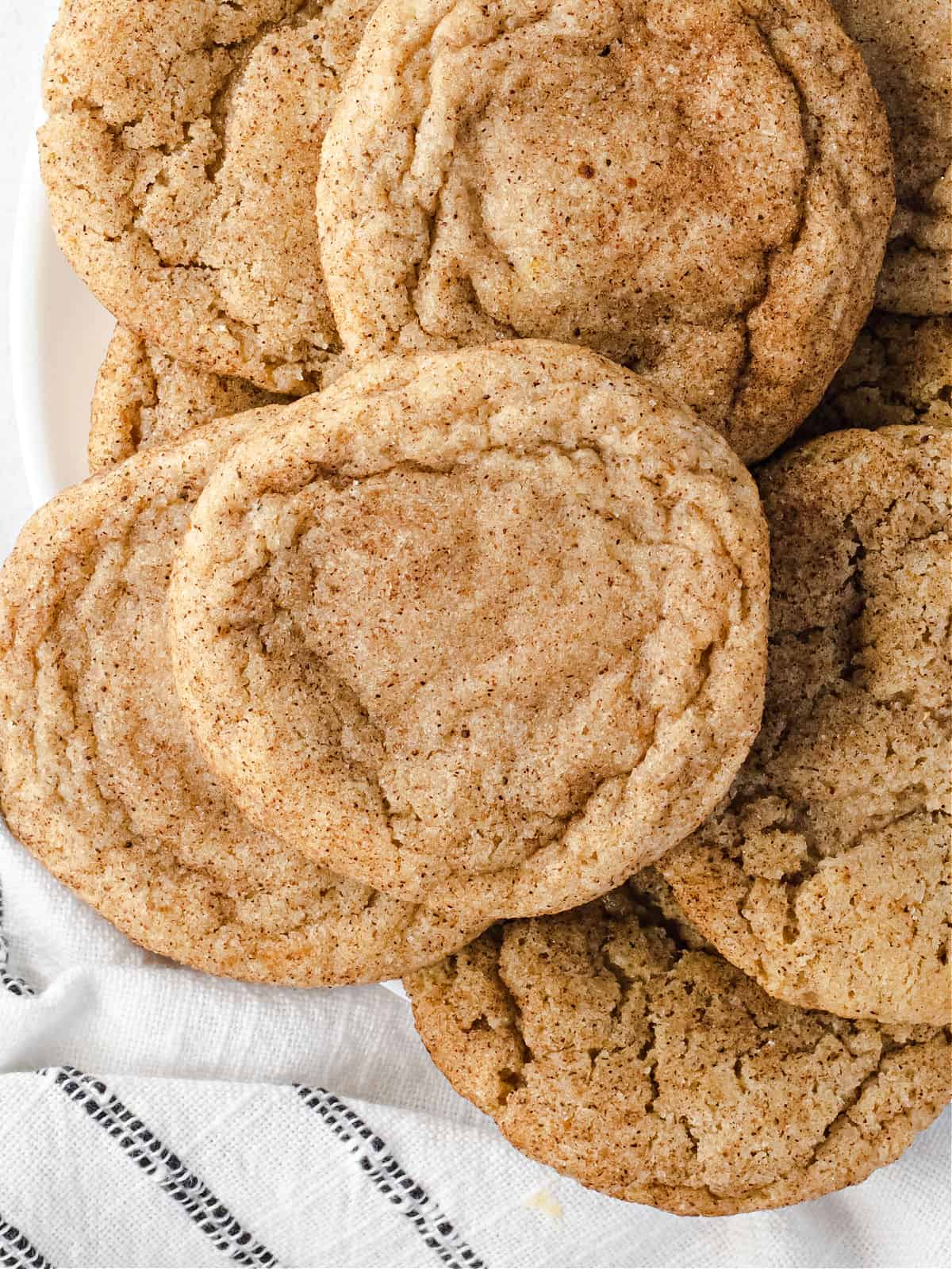 Chai spiced cookies on a plate stacked.