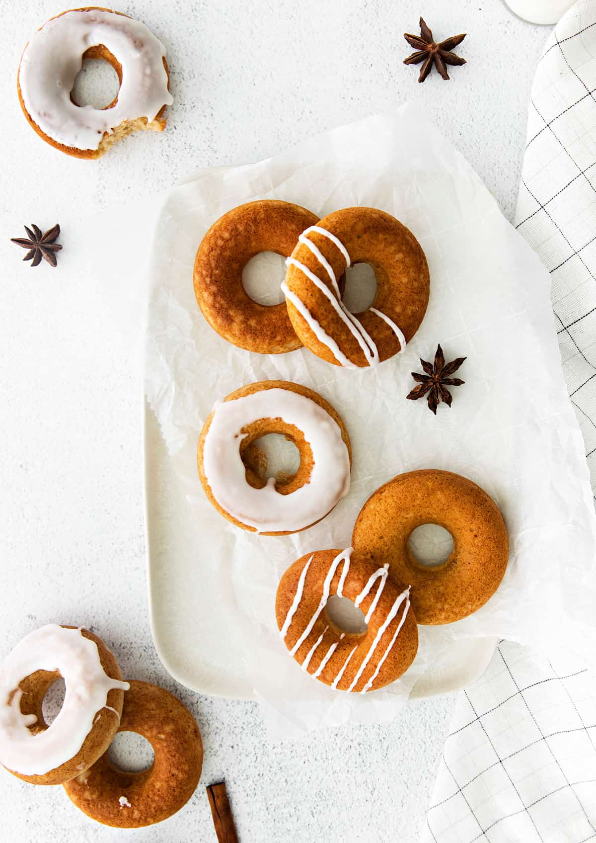 White serving plate with chai donuts.